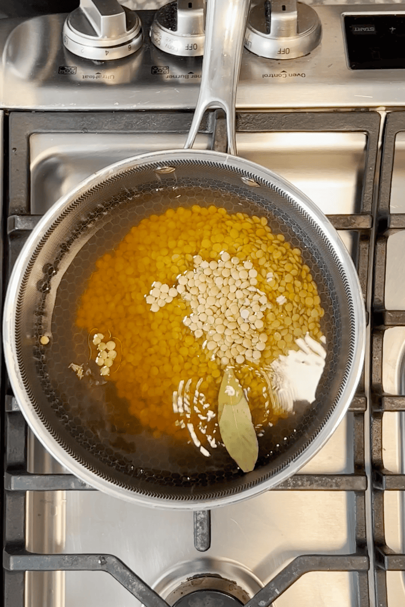 Lentils cooking in a pot.