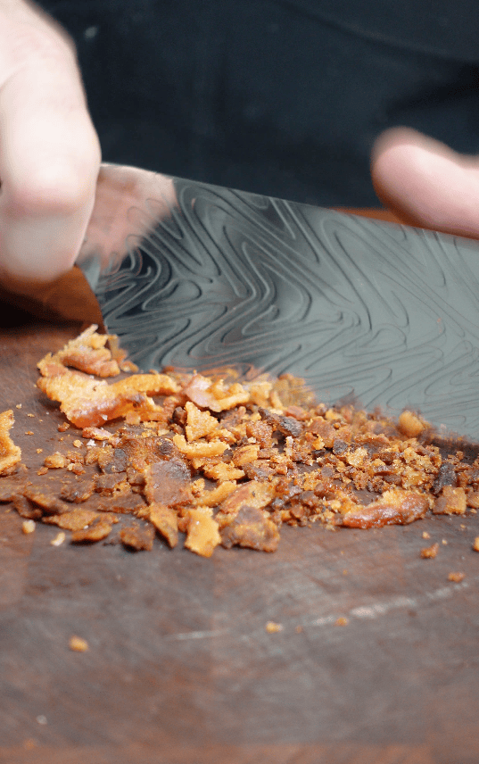 Bacon being chopped up.