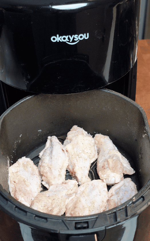 Wings going in an air fryer.
