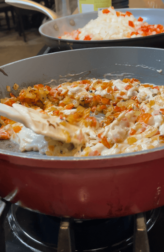 Chicken with spinach on a skillet.