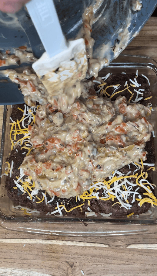 Mixture pouring over burger patties.