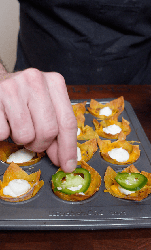 A taco wonton with a jalapeño.