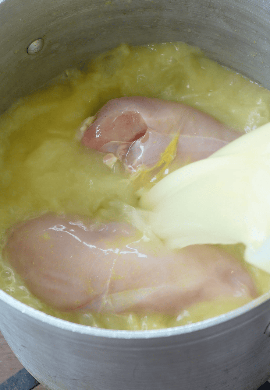 Chicken breasts in broth.