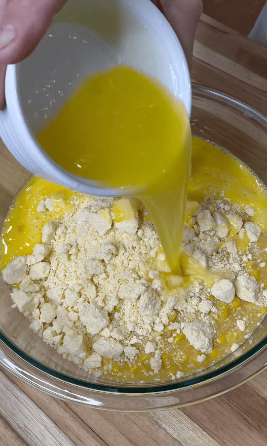 Eggs going into corn casserole.