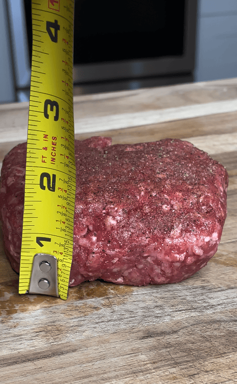 A measuring tape with burger patty.