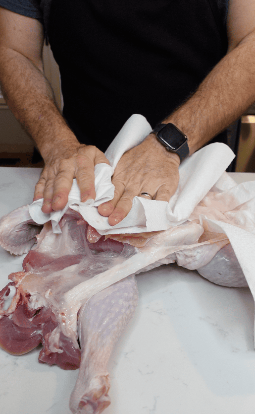 A turkey being dried off.