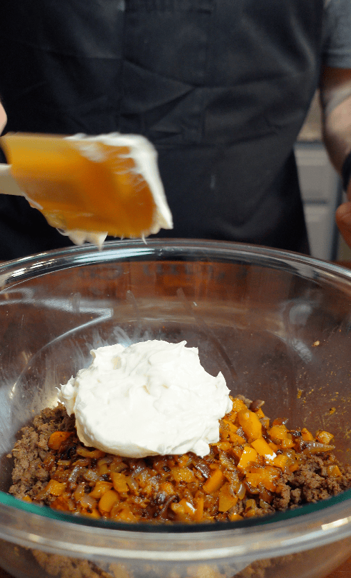 Cream cheese going into mixing bowl.