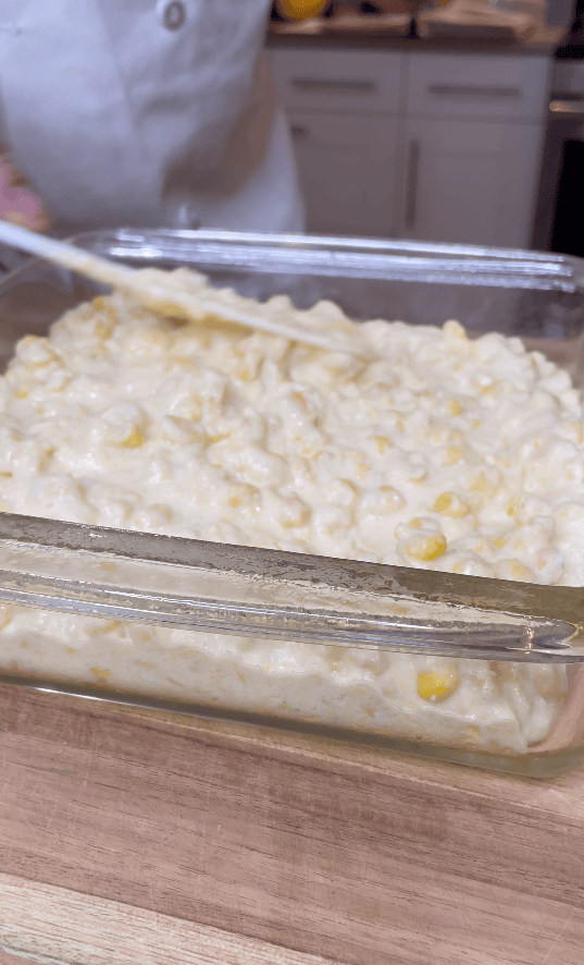 Corn casserole mixture in a dish.