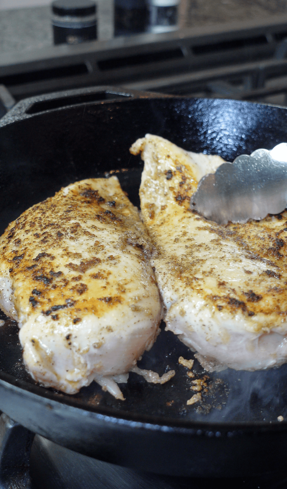 Chicken cooking in a skillet.