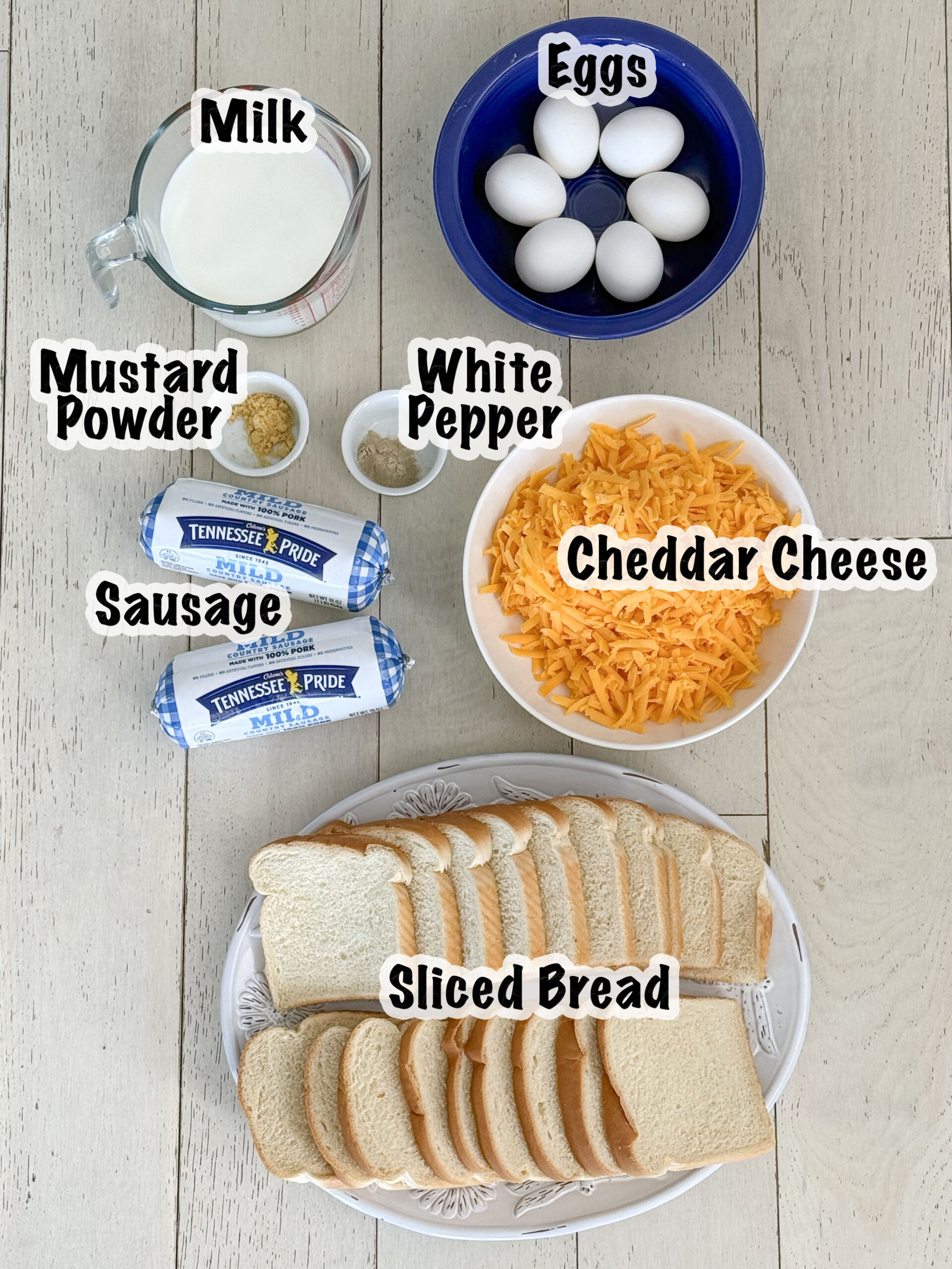 Ingredients for making sausage egg casserole measured out in bowls.