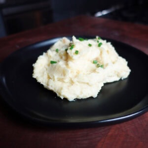 Garlic mashed potatoes on a plate.