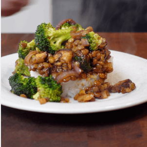 Broccoli and lentils on a plate.