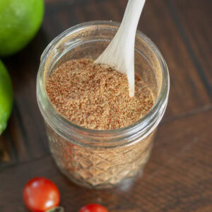 A jar filled with taco seasoning.