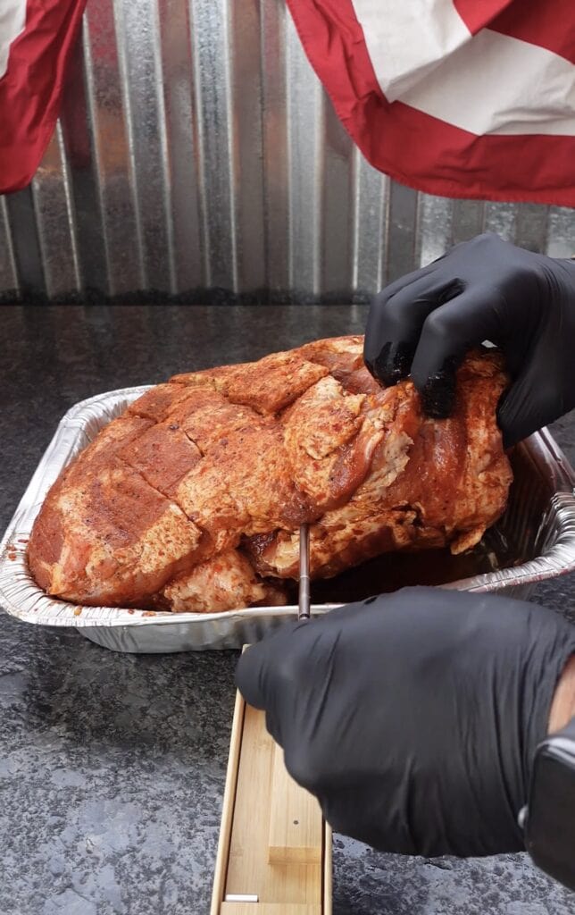 A thermometer in a pork butt.