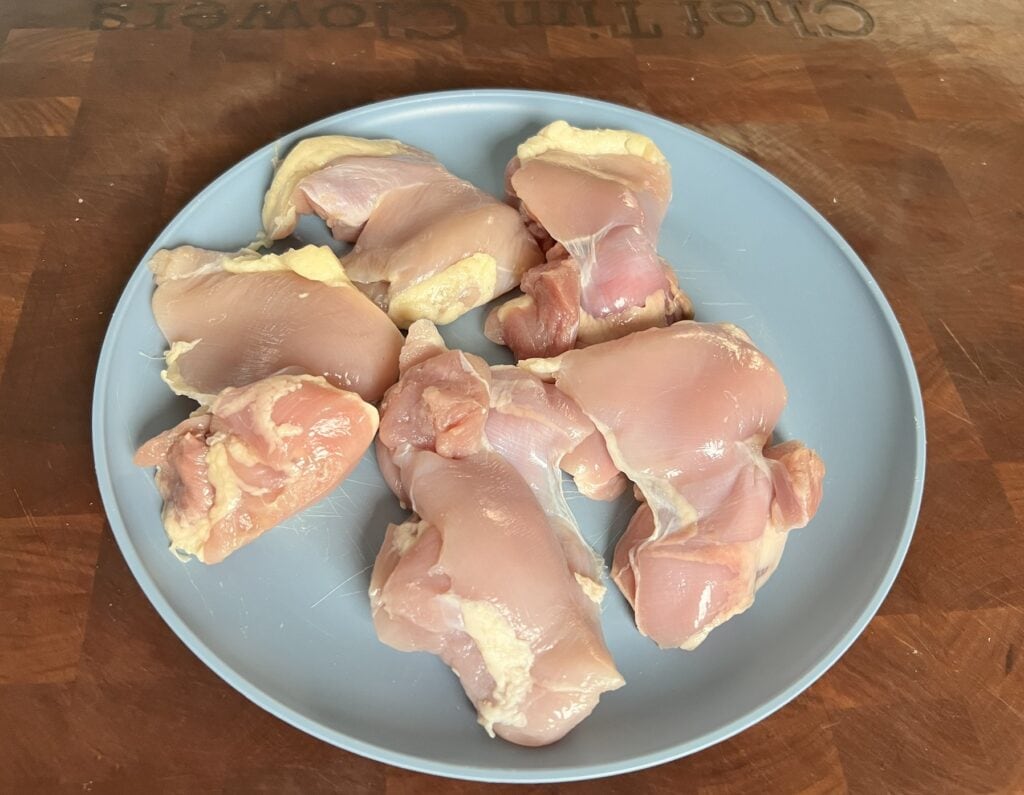 Diced onions and peppers in a pot.
