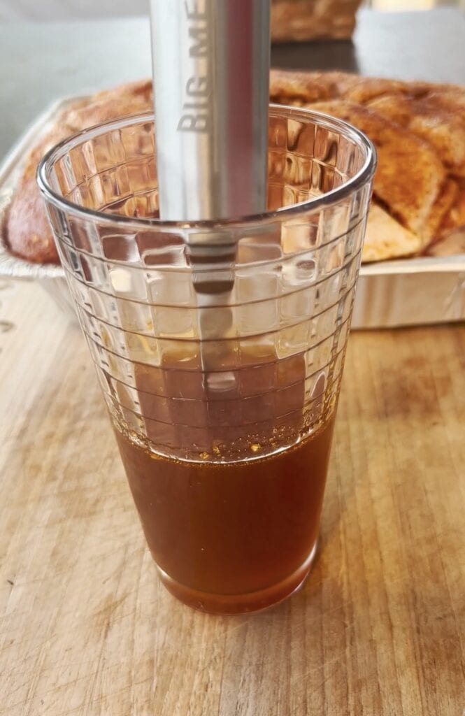 Juice in a glass with injector.