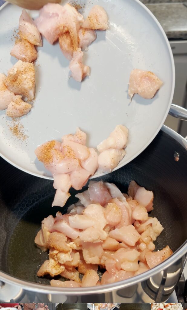 Cubed chicken in a stock pot.