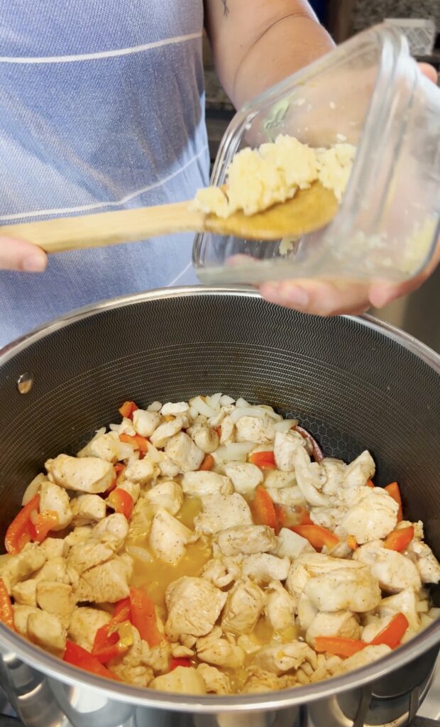 Garlic going into the pot.