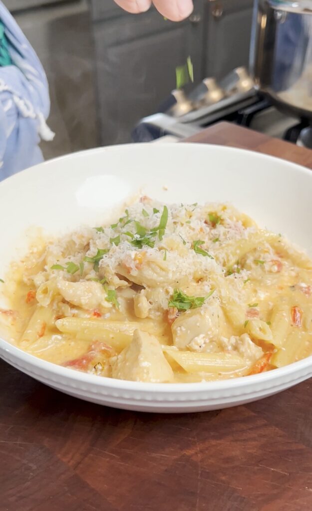 A bowl of cajun chicken pasta.