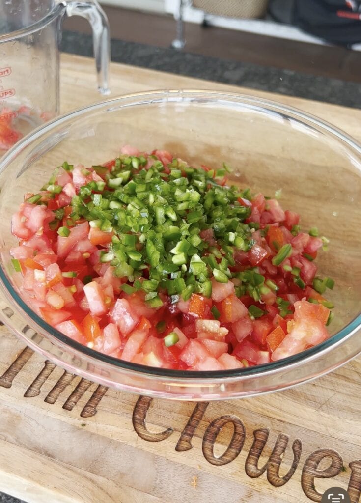 Diced jalapeños over tomatoes.