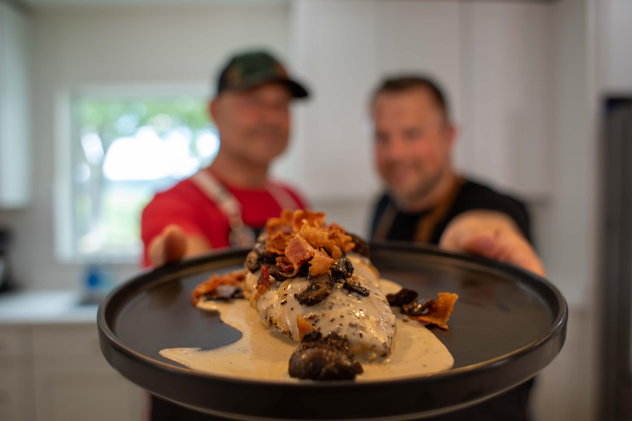 Black Peppered chicken on a plate.