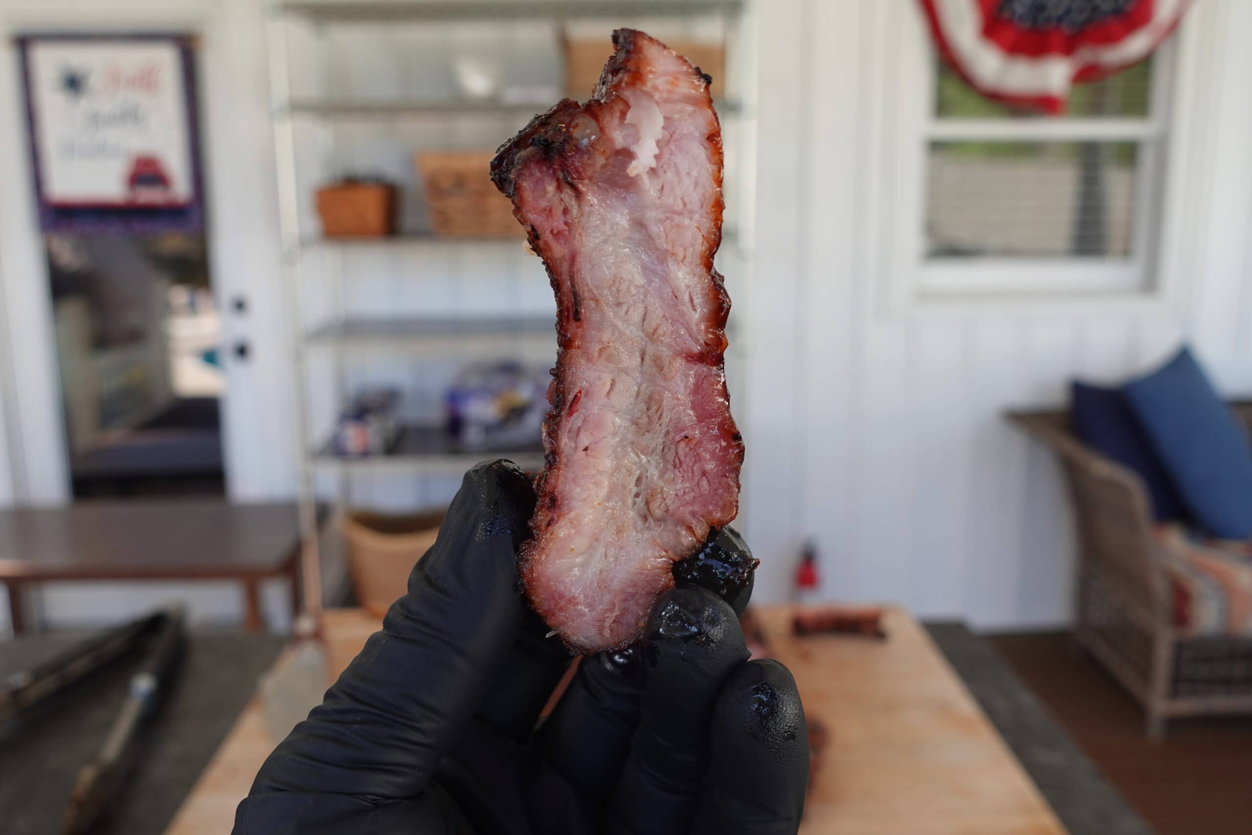 Tim patting the ribs dry with a paper towel.