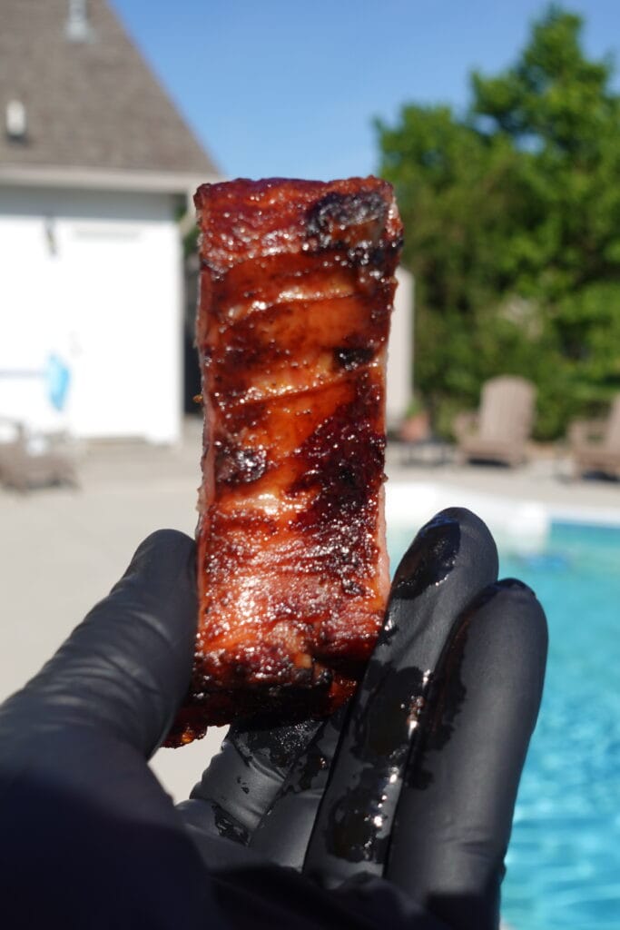 A shiny Smoked BBQ Pork Rib.