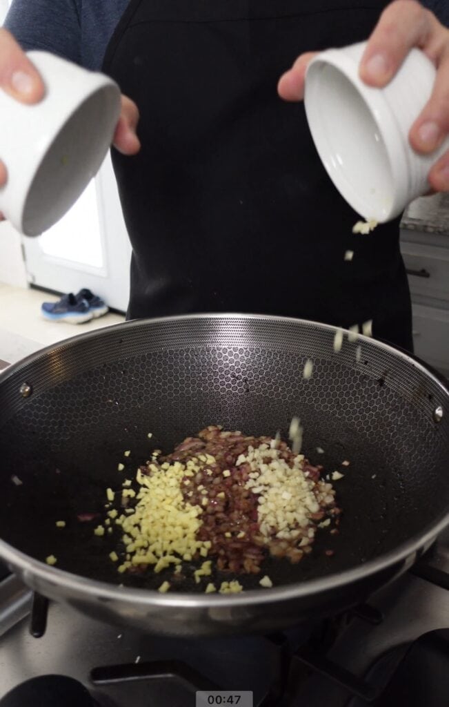 Garlic and Ginger cooking in wok.