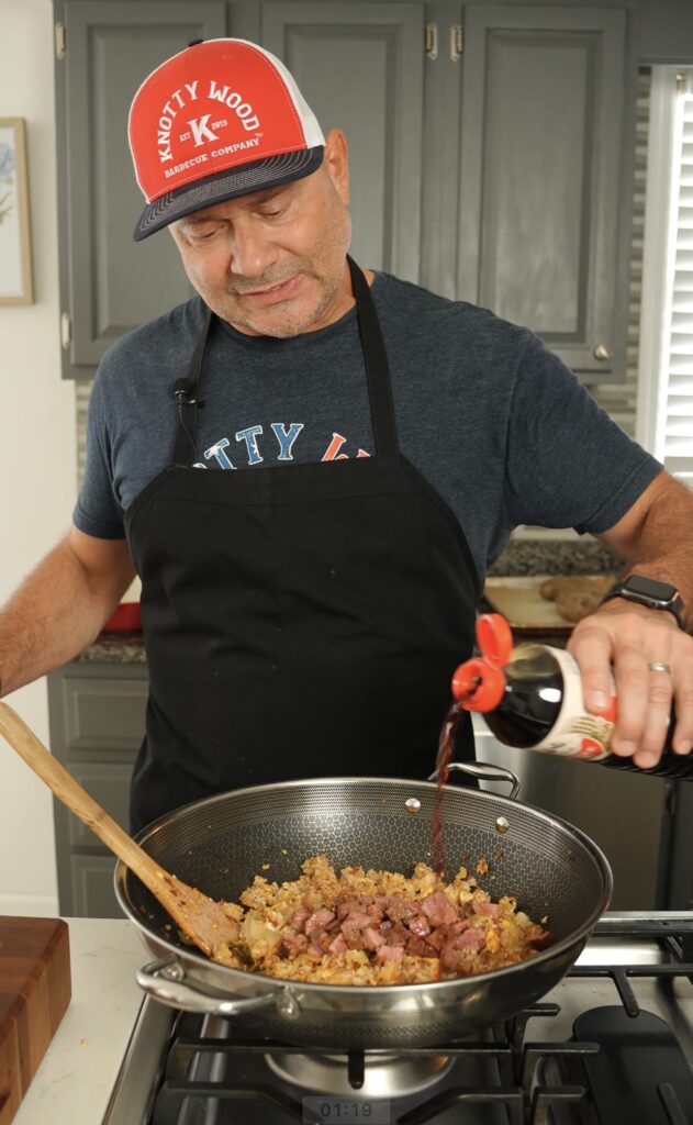 Soy sauce going into a wok.