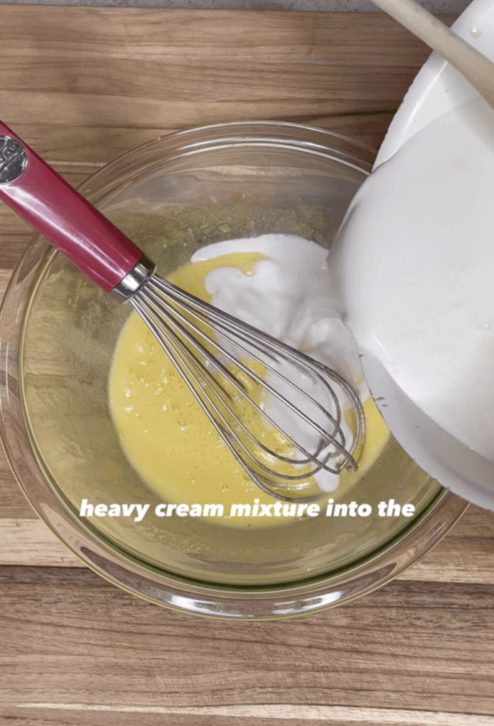 Pouring heaving cream into a bowl.