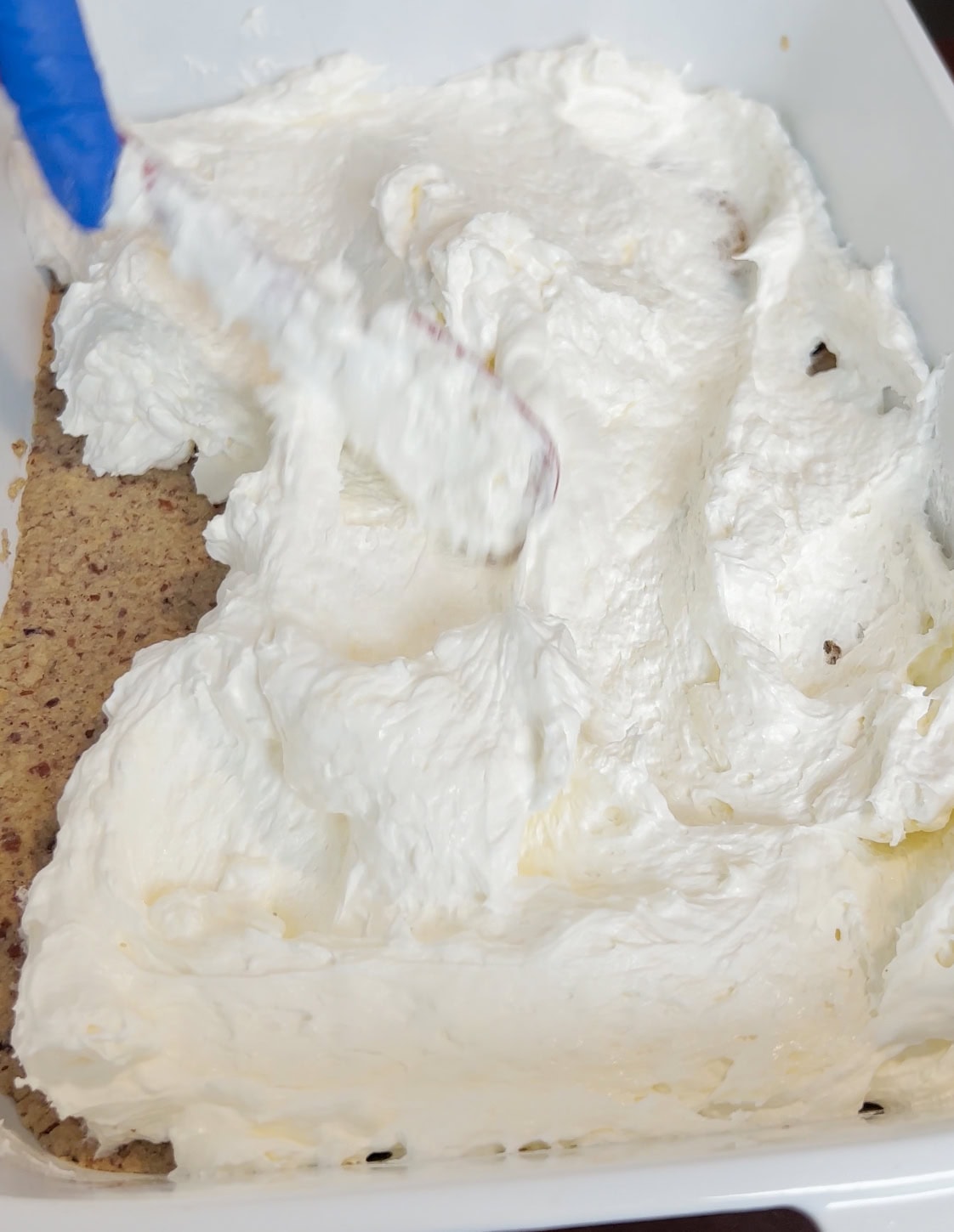 Second layer going onto crust.