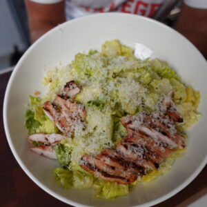 A bowl of caesar salad.