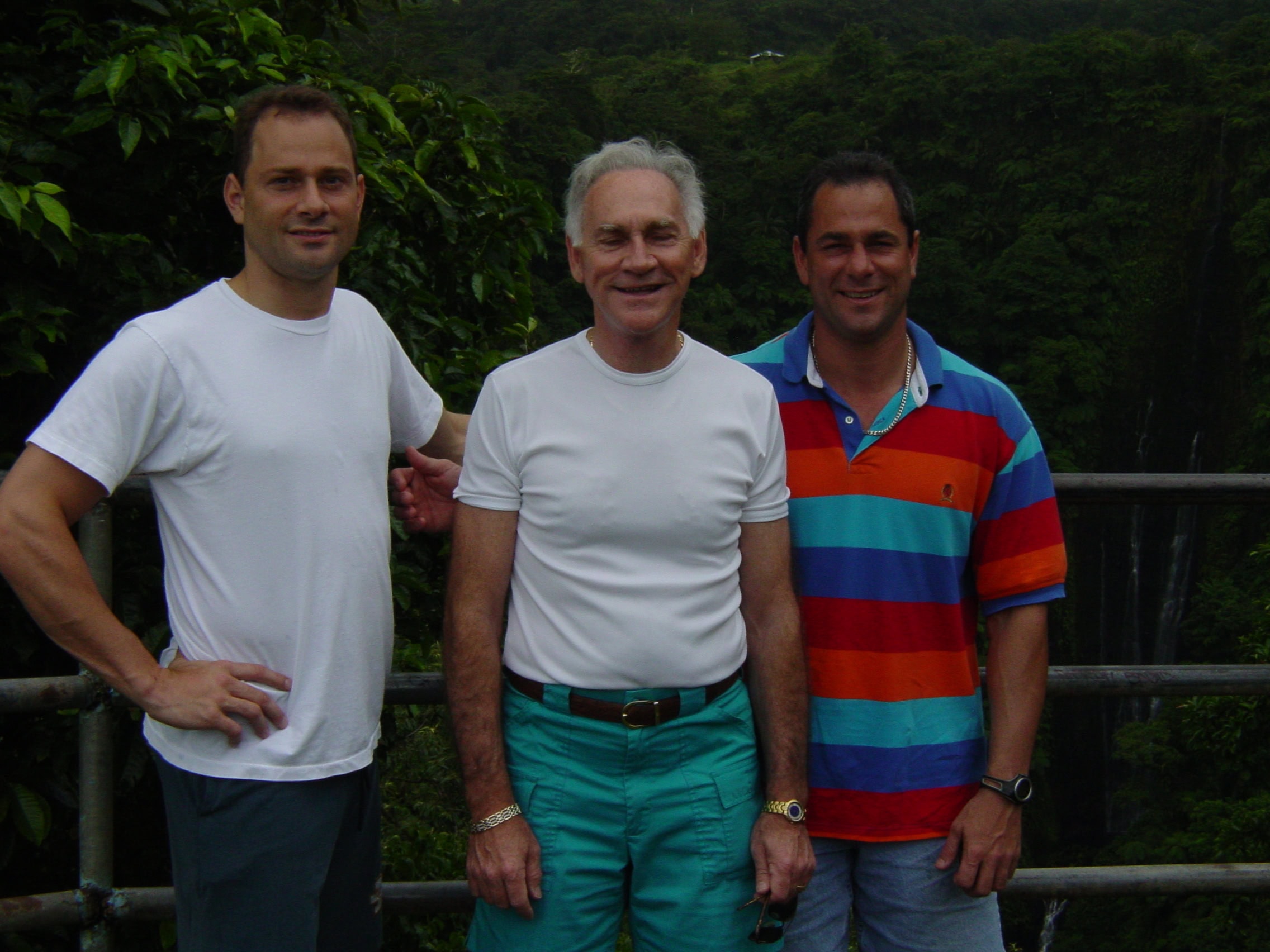 Tim with his dad and brother in the forest.