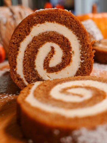 A pumpkin roll with cream cheese swirl.