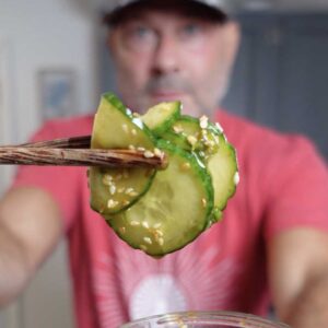 Cucumber slices marinading in Asian sauce.
