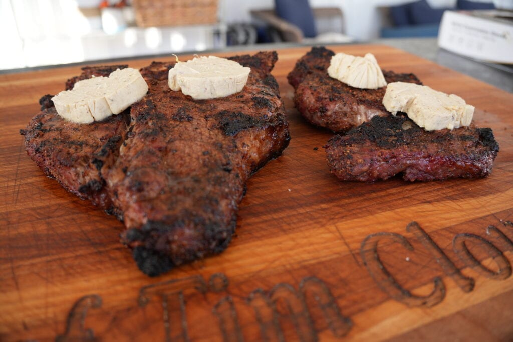 Steak with butter on it.