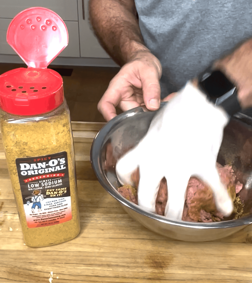 Mixing armadillo egg mixture together.