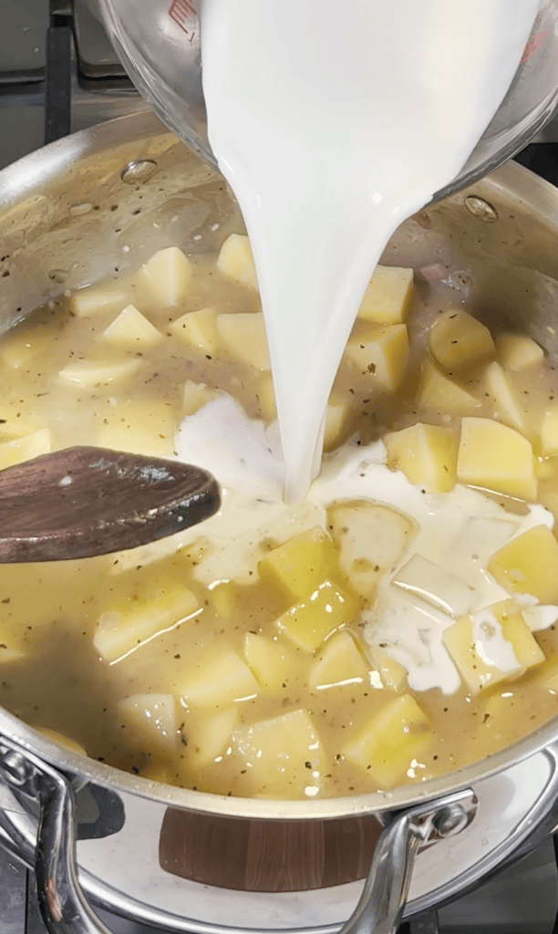 Cream going into potato soup.