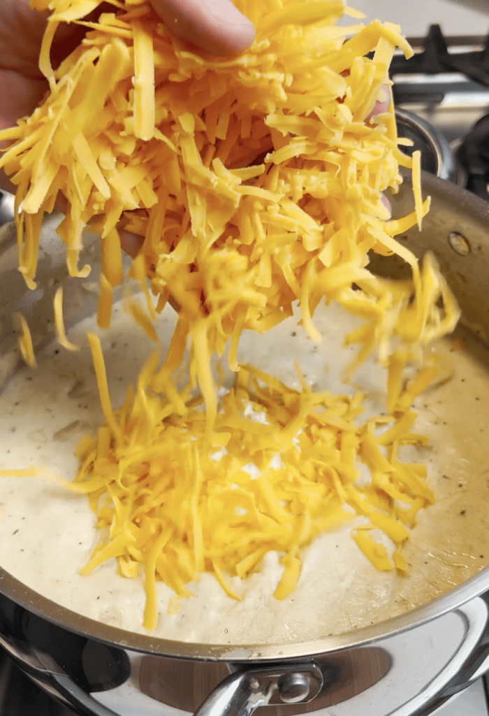 Cheese going into soup.