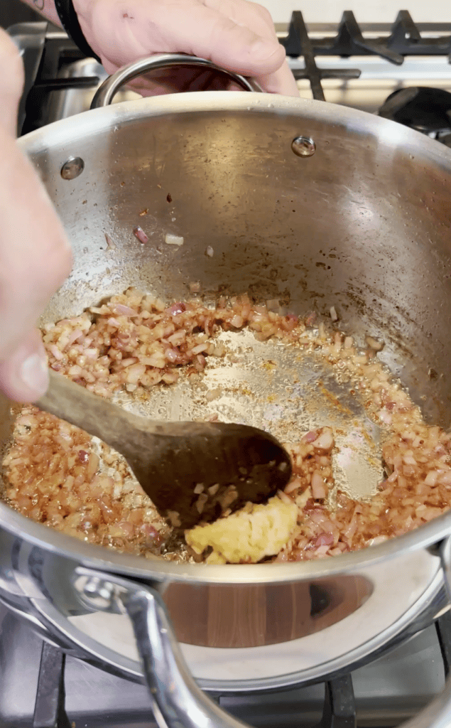 Onions cooking in a pot.