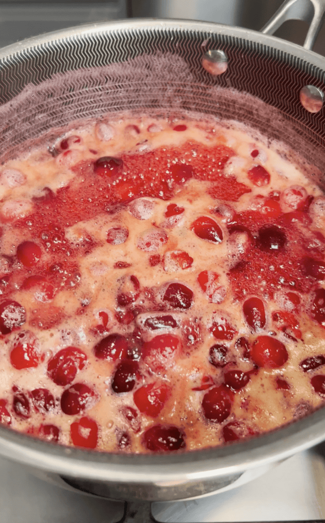 Cranberries and juices in a pot.