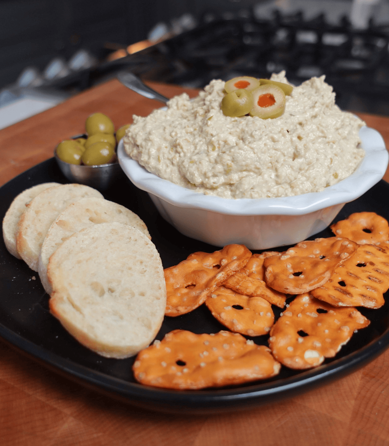 Olive dip with pretzels.