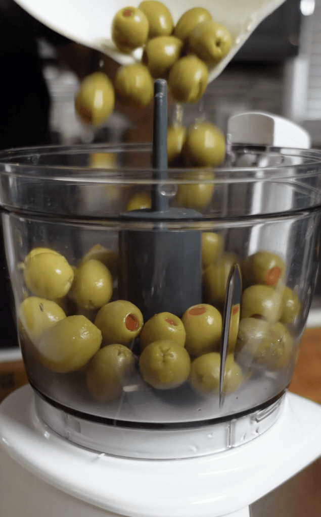 Olives in a food processor.