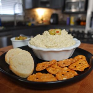 Olive dip with pretzels.