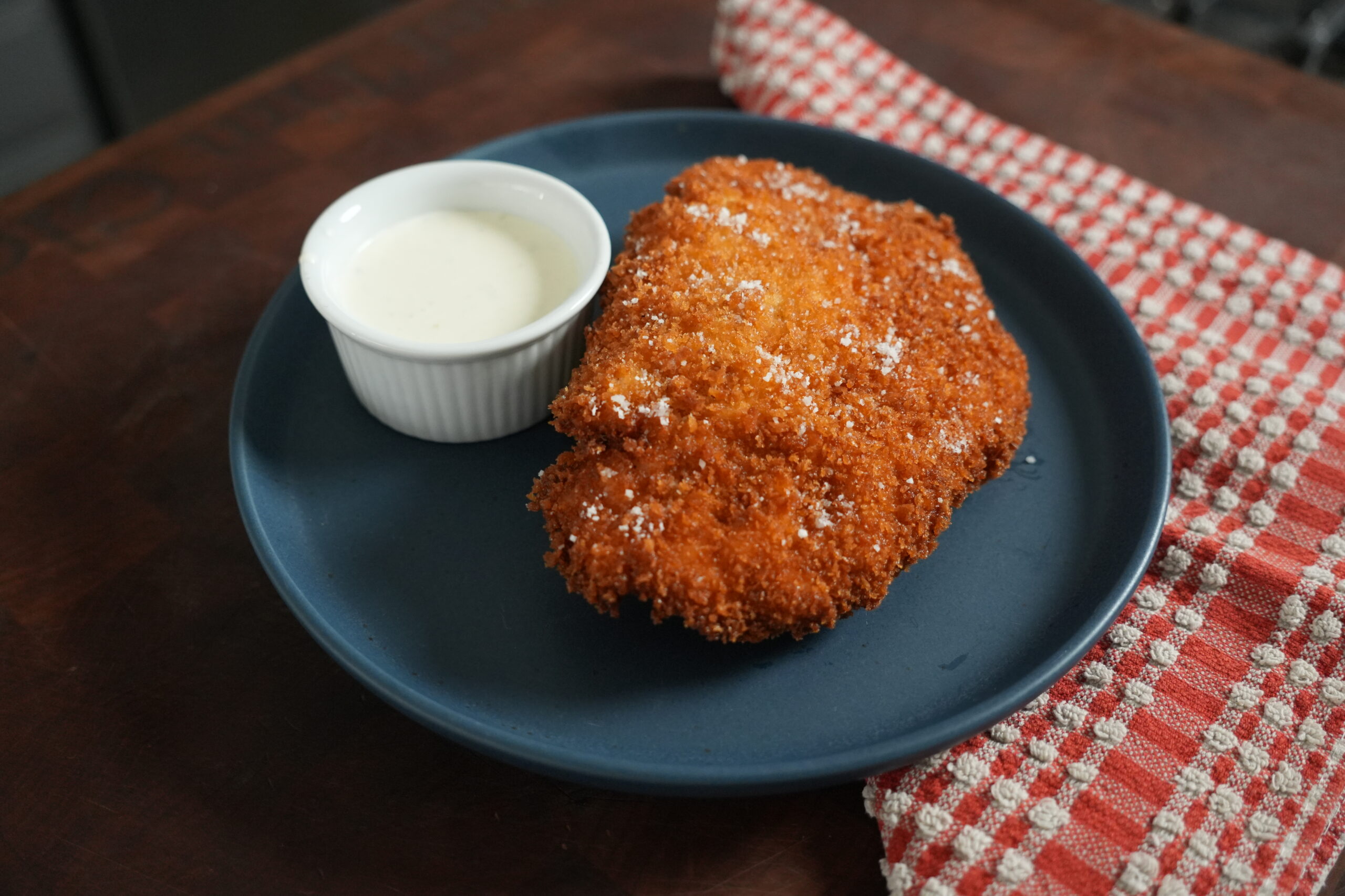 Chicken Katsu on a plate with ranch.