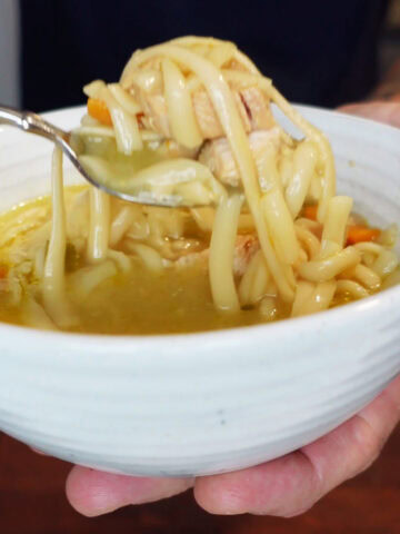 A bowl of chicken noodle soup.