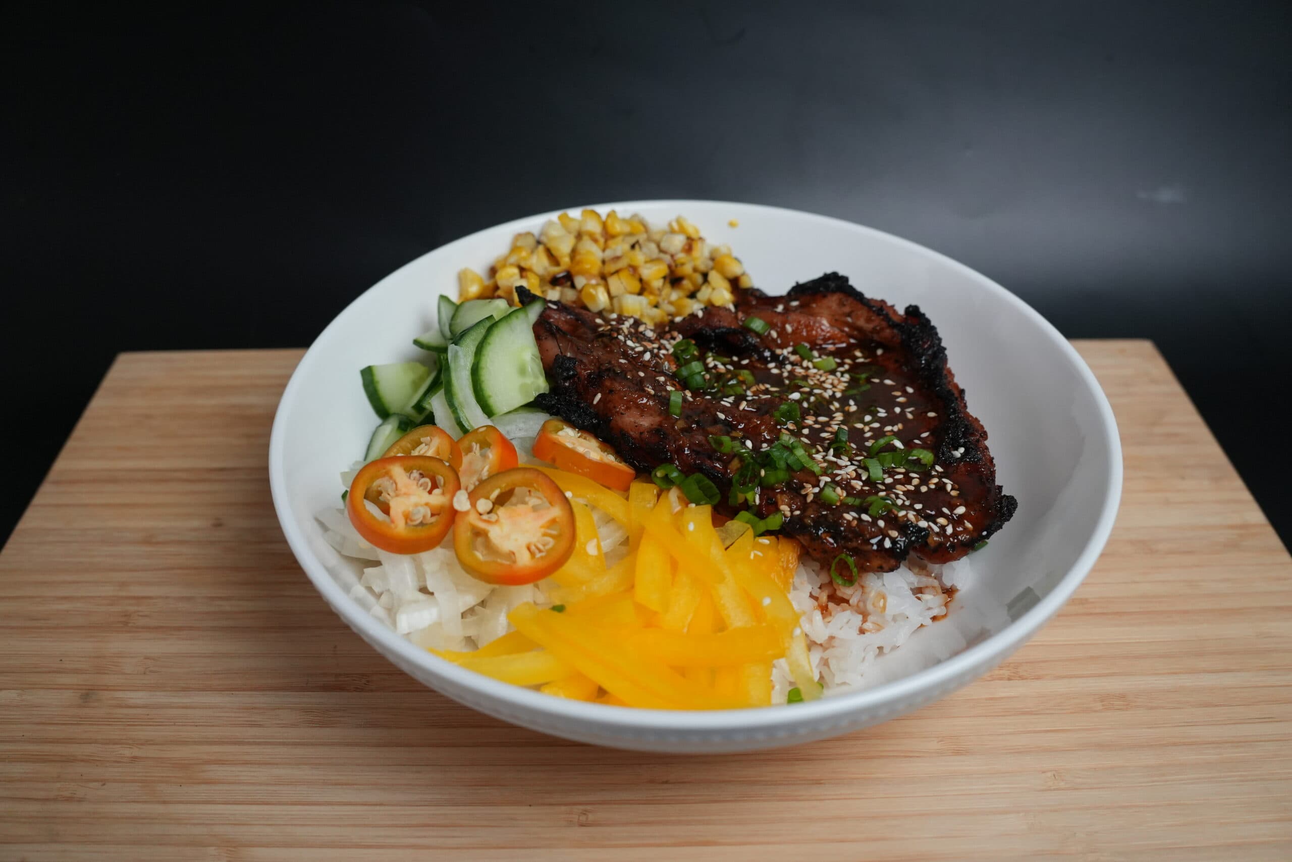 A Korean Pork Bowl with vegetables.