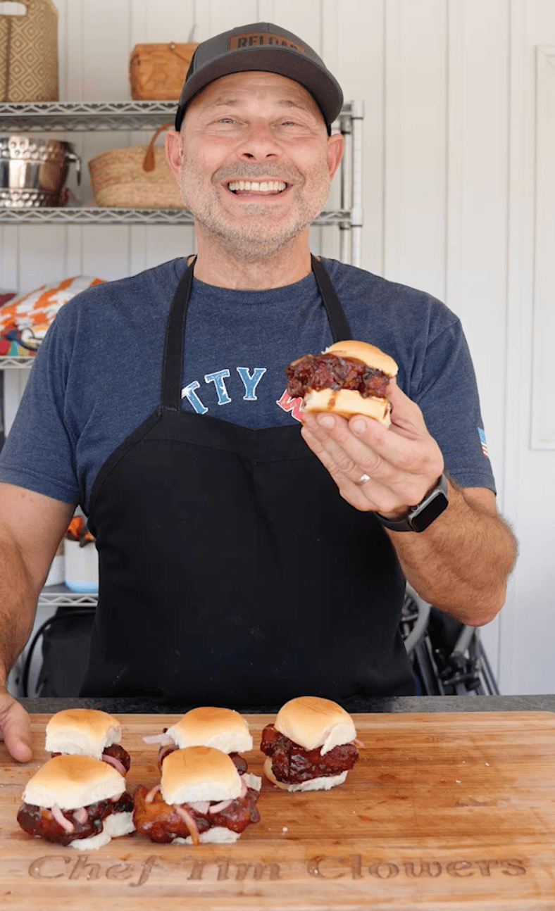 Tim holding a McRib Sandwich.