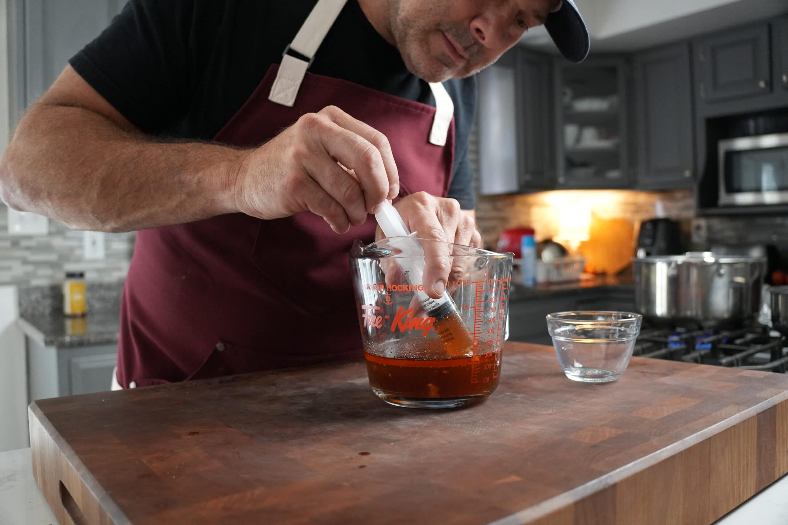 Separating fat in turkey drippings.
