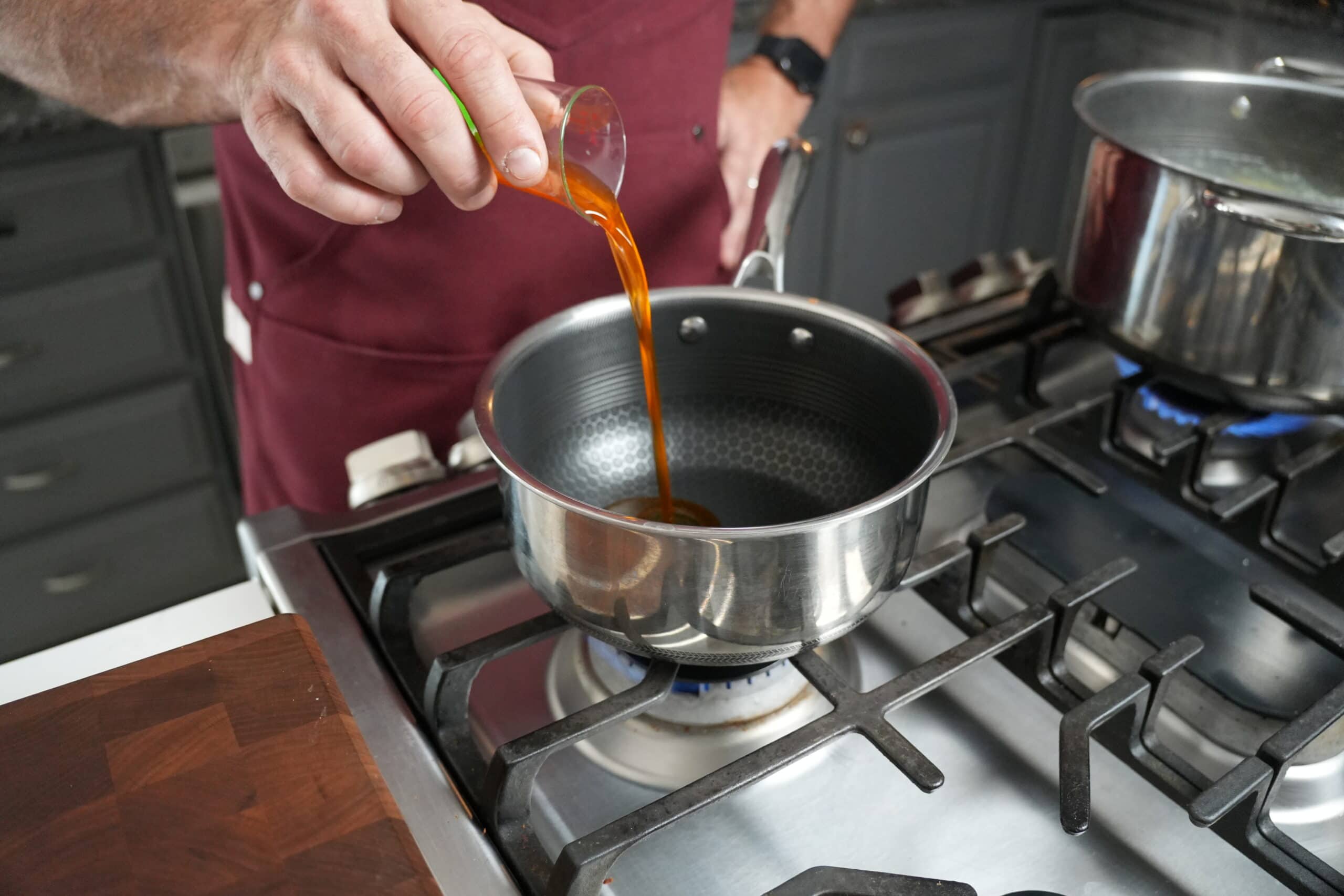 Oil going into a stock pot.